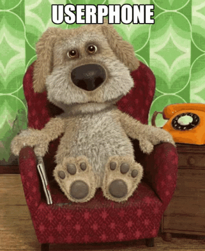 Stuffed Dog Sitting In Red Chair GIF