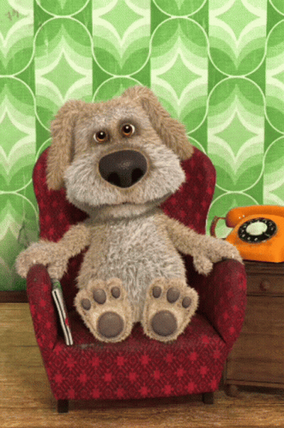 Stuffed Dog Sitting In Red Chair Next To Orange Phone GIF