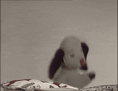 Stuffed Dog Wearing Headphones And Waving GIF