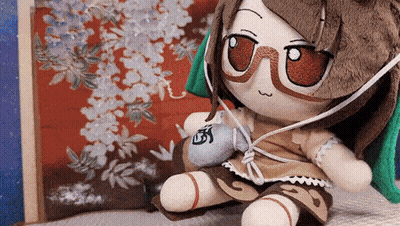 Stuffed Doll Wearing Glasses And Headphones GIF