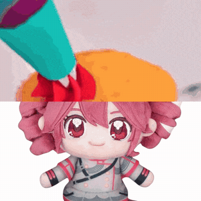 Stuffed Doll With Pink Hair And Red Eyes Being Painted GIF