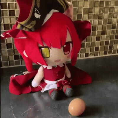 Stuffed Doll With Red Hair And Yellow Eyes Next To Ball GIF