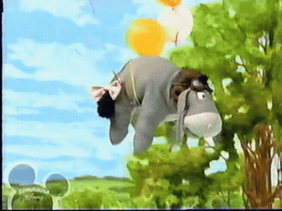 Stuffed Donkey Hanging From Tree With Balloons GIF