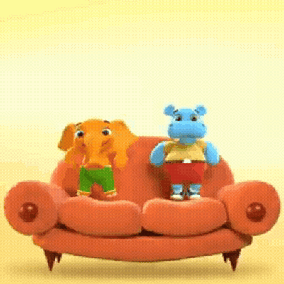 Stuffed Elephant And Hippo Sitting On Orange Couch GIF