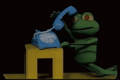 Stuffed Frog Talking on Blue Telephone