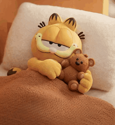 Stuffed Garfield Laying In Bed With Teddy Bear GIF