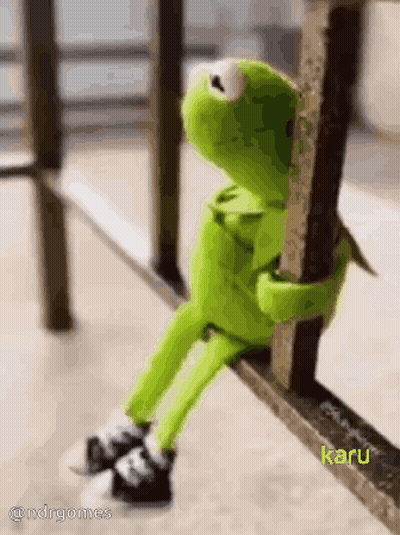 Stuffed Kermit Sitting On Railing GIF