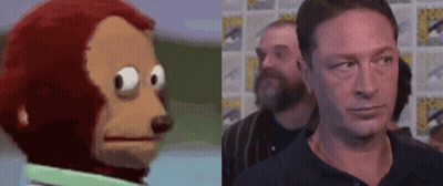 Stuffed Monkey Next To Man GIF