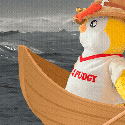 Stuffed Penguin In Puddy Shirt On Boat In Ocean GIF