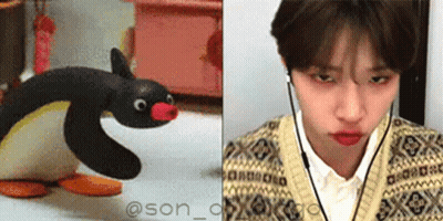 Stuffed Penguin Next To Man With Headphones GIF