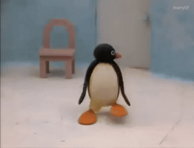 Stuffed Penguin Walking On Snow GIF