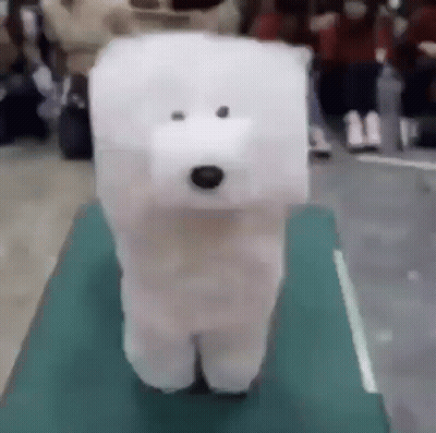 Stuffed Polar Bear Standing On Table GIF