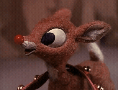 Stuffed Reindeer With Red Nose And Bells GIF