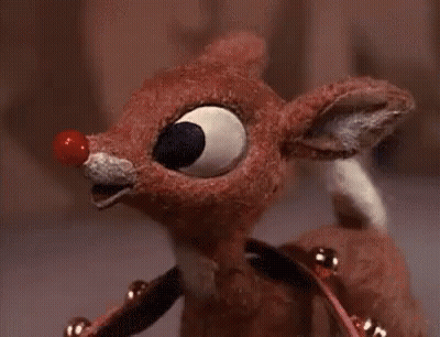 Stuffed Reindeer With Red Nose And Bells GIF