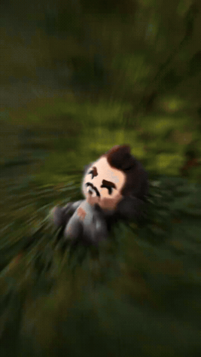 Stuffed Toy Man With Beard Sitting In Grass GIF