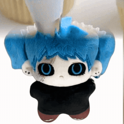 Stuffed Toy With Blue Hair and Big Eyes