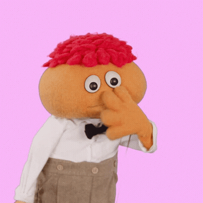Stuffed Toy With Bow Tie And Red Hair GIF