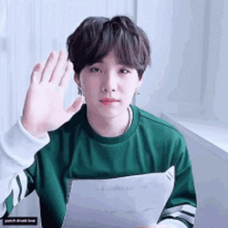 Suga Holding Paper While Saying Goodbye GIF