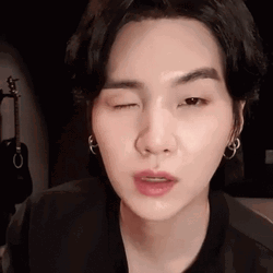 Suga Winking While Raising Eyebrows GIF
