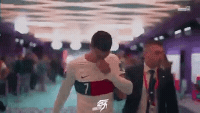 Suit And Tie Man And Soccer Jersey Man GIF