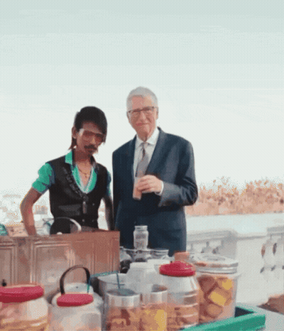 Suit And Tie Man Beside Green Shirt Man GIF