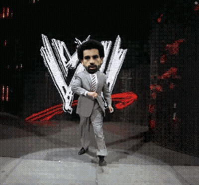Suit And Tie Man Dancing On Stage With W Logo GIF