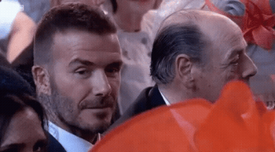 Suit And Tie Man Eyes Another In Crowd GIF