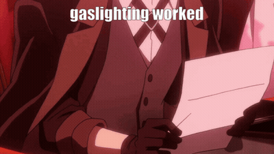 Suit And Tie Man Holding Gaslighting Worked Sign GIF