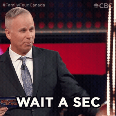 Suit-And-Tie Man Saying Wait A Sec GIF