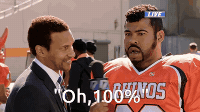Suit And Tie Man Talks To Bulldogs Fan GIF