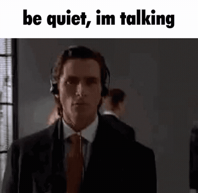 Suit-And-Tie Man With Headphones Be Quiet Im Talking GIF