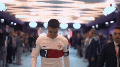 Suit-And-Tie Man With Soccer Player In White GIF