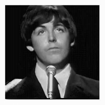 Suit-And-Tie Young Man Singing Into Microphone GIF
