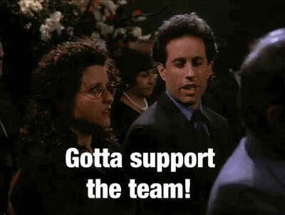 Suited Man And Woman Gotta Support The Team GIF