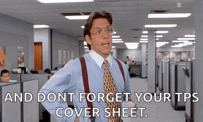 Suited Man Holding Coffee And Cover Sheet GIF