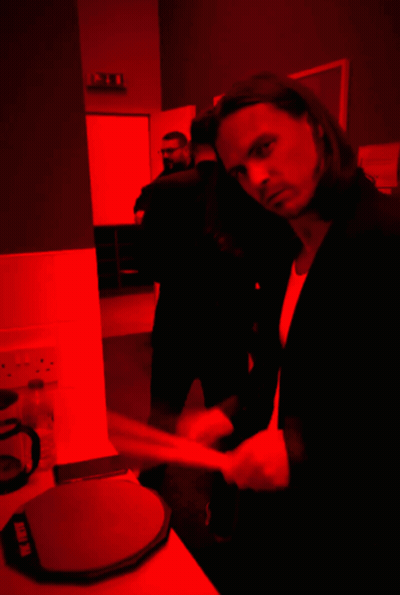 Suited Man In Dark Room With Red Light Saying Ikea GIF