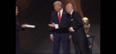 Suited Man Shaking Hands Woman Holding Paper GIF