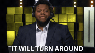 Suited Man With Headphones Saying It Will Turn Around GIF