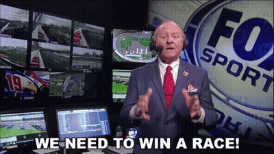 Suited Man With Tie At Fox Sport Sign GIF