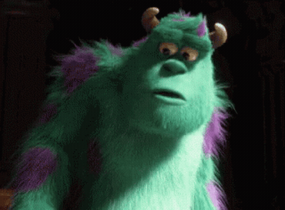 Sulley From Monsters Inc Is A Green And Purple Furry Monster With Horns And A Surprised Look On His Face . GIF