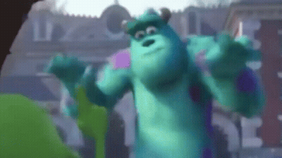 Sulley From Monsters Inc Is Dancing In Front Of A Building In A Blurry Photo . GIF