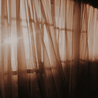 Sun Shining Through Sheer Curtains GIF