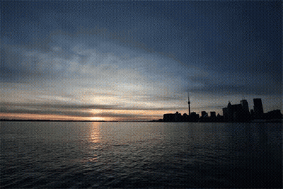 Sunset Over City Skyline GIF