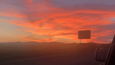 Sunset Over Highway With Mountains GIF