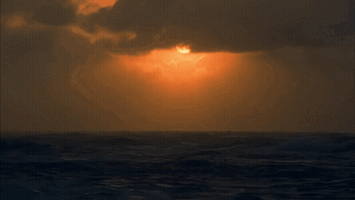 Sunset Over Ocean With Clouds GIF