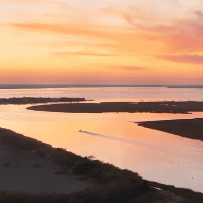 Sunset Over Water With Island GIF
