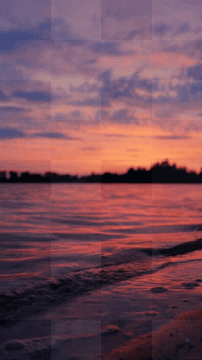 Sunset Over Water With Pink And Purple Sky GIF