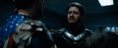 Superhero And American Flag Costumed Men GIF