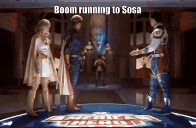 Superhero Group On Stage With Boom Running To Sosa Sign GIF