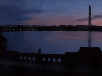 Superhero Man In Front Of Ambulance At Night GIF